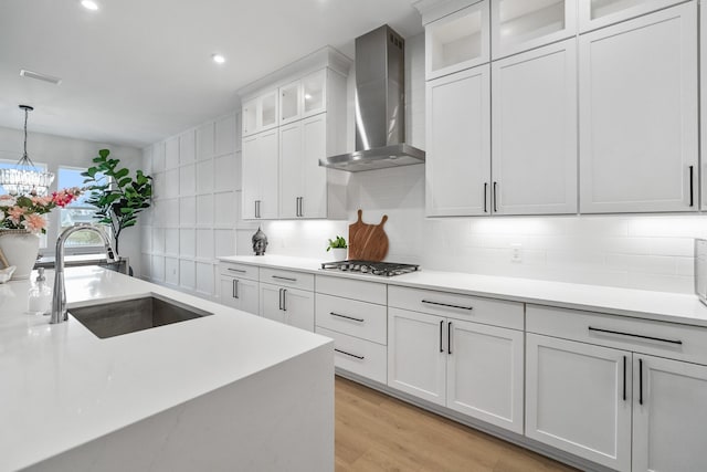 425 W Lafayette, Inlet Beach, FL 32461 - kitchen with a sink, wall chimney range hood, light countertops, backsplash, and recessed lighting