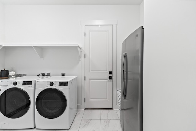 425 W Lafayette, Inlet Beach, FL 32461 - laundry area with washer and clothes dryer and light marble finish floors