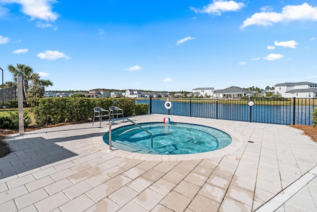 425 W Lafayette, Inlet Beach, FL 32461 - view of swimming pool featuring a hot tub, a water view, a residential view, and a patio area