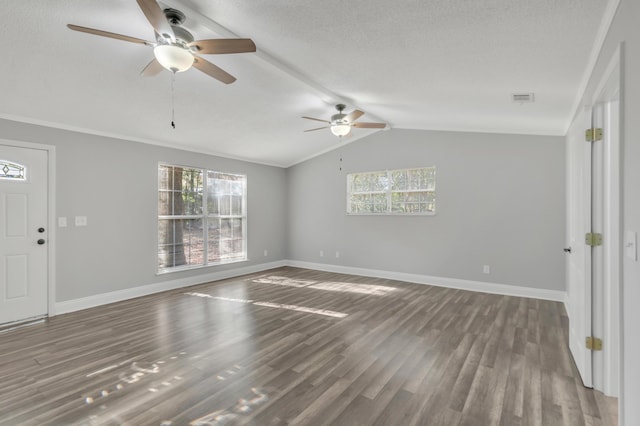 319 Jones Rd, Crestview, FL 32536 - empty room featuring a ceiling fan, wood finished floors, baseboards, lofted ceiling, and a textured ceiling