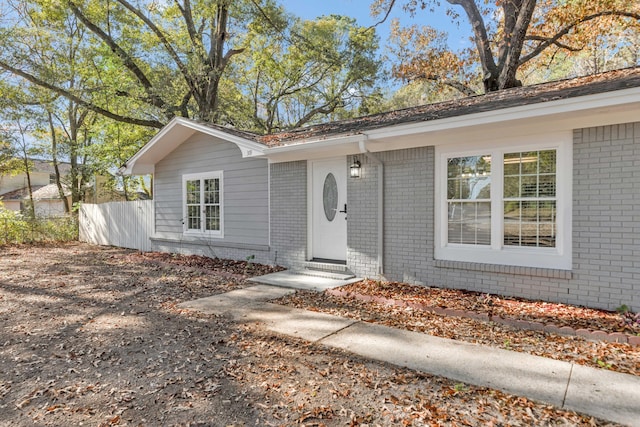 319 Jones Rd, Crestview, FL 32536 - view of front of property with brick siding, fence, and entry steps