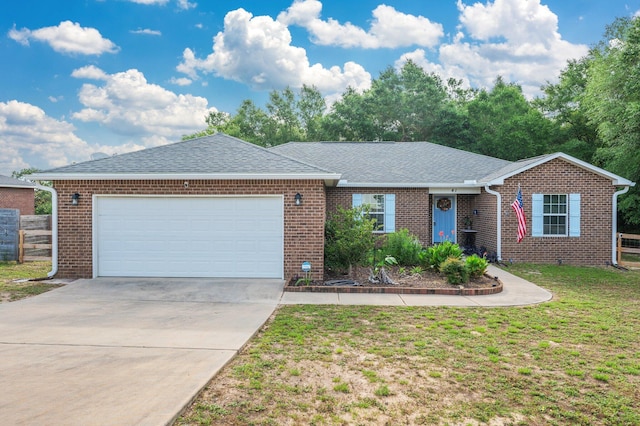 41 S Hidden Lakes Trl, Defuniak Springs, FL 32433 - single story home with a garage, concrete driveway, roof with shingles, and brick siding