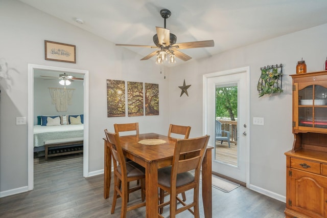41 S Hidden Lakes Trl, Defuniak Springs, FL 32433 - dining space featuring a ceiling fan, dark wood-type flooring, baseboards, and vaulted ceiling