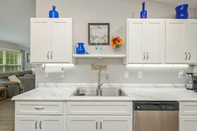 41 S Hidden Lakes Trl, Defuniak Springs, FL 32433 - kitchen with stainless steel dishwasher, a sink, white cabinetry, and light stone counters