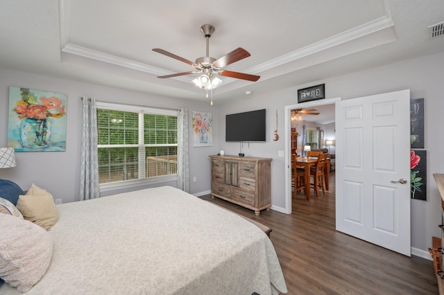 41 S Hidden Lakes Trl, Defuniak Springs, FL 32433 - bedroom featuring a tray ceiling, crown molding, dark wood-style floors, baseboards, and a ceiling fan