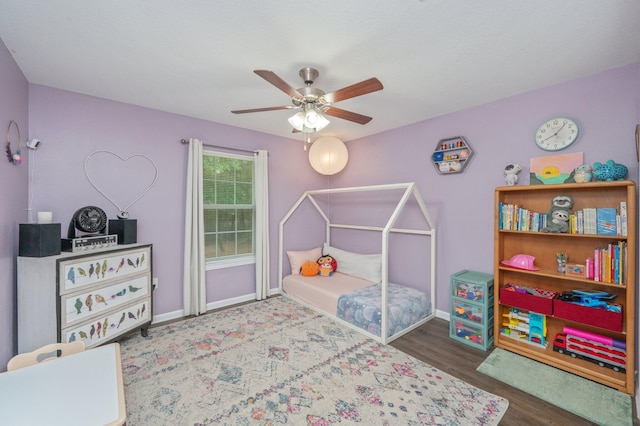 41 S Hidden Lakes Trl, Defuniak Springs, FL 32433 - bedroom featuring baseboards, wood finished floors, and a ceiling fan
