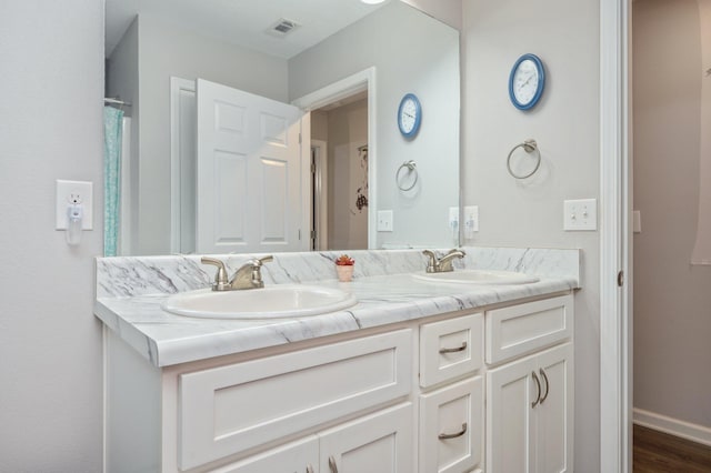 41 S Hidden Lakes Trl, Defuniak Springs, FL 32433 - full bath with double vanity, baseboards, and wood finished floors