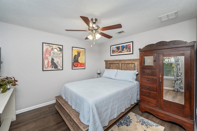 41 S Hidden Lakes Trl, Defuniak Springs, FL 32433 - bedroom featuring baseboards, wood finished floors, a ceiling fan, and a textured ceiling