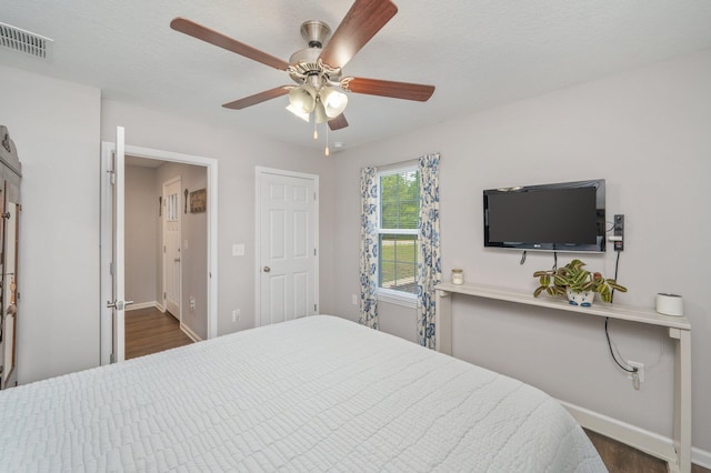 41 S Hidden Lakes Trl, Defuniak Springs, FL 32433 - bedroom featuring dark wood-style floors, baseboards, and ceiling fan