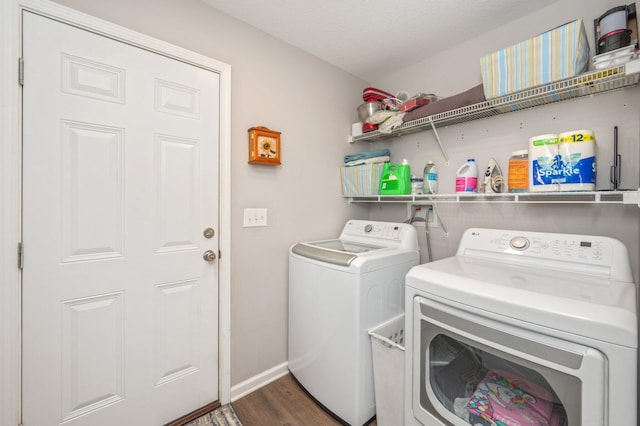41 S Hidden Lakes Trl, Defuniak Springs, FL 32433 - laundry area featuring washing machine and dryer, wood finished floors, and baseboards