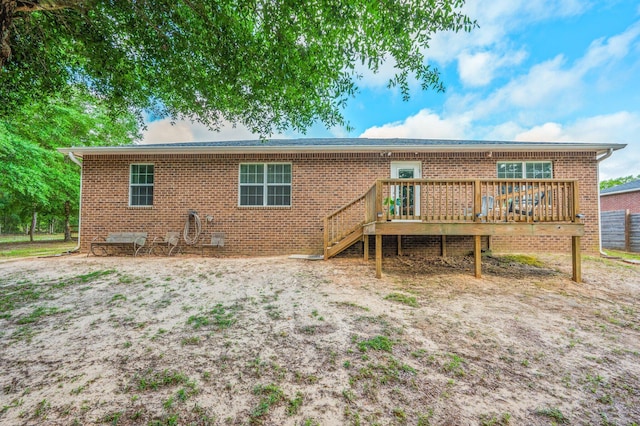 41 S Hidden Lakes Trl, Defuniak Springs, FL 32433 - back of property with a wooden deck and brick siding