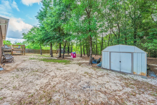 41 S Hidden Lakes Trl, Defuniak Springs, FL 32433 - view of yard with a shed, an outdoor structure, and fence