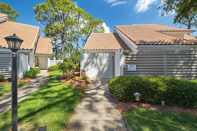 5144 Beachwalk Cir, Miramar Beach, FL 32550 - view of side of property with a tile roof and stucco siding