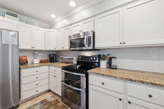 5144 Beachwalk Cir, Miramar Beach, FL 32550 - kitchen featuring appliances with stainless steel finishes, crown molding, tasteful backsplash, white cabinets, and recessed lighting