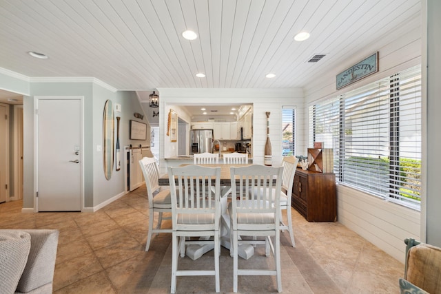 5144 Beachwalk Cir, Miramar Beach, FL 32550 - dining space with recessed lighting, crown molding, light tile patterned floors, and wood ceiling