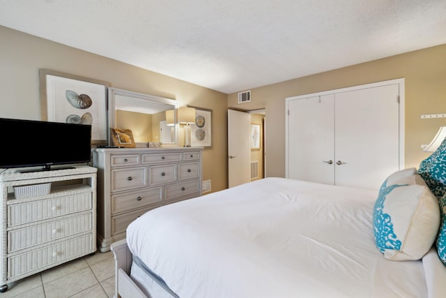 5144 Beachwalk Cir, Miramar Beach, FL 32550 - bedroom with a closet and light tile patterned flooring