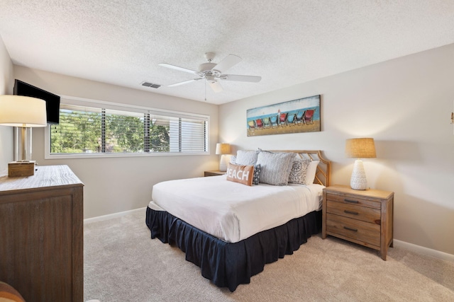 5144 Beachwalk Cir, Miramar Beach, FL 32550 - bedroom featuring carpet, a textured ceiling, baseboards, and ceiling fan