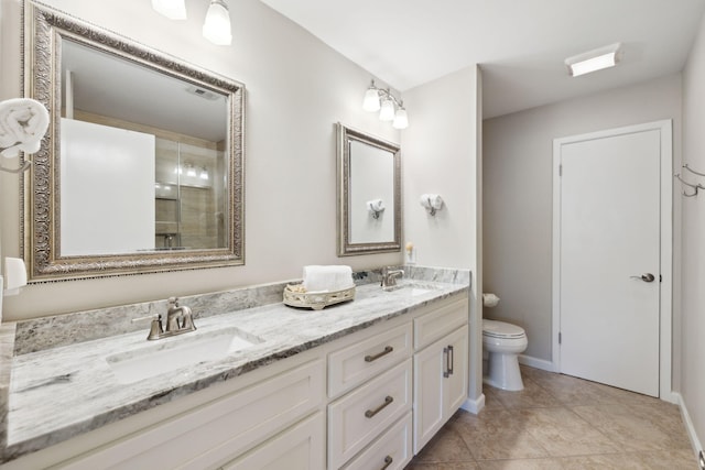 5144 Beachwalk Cir, Miramar Beach, FL 32550 - full bathroom with toilet, a tile shower, double vanity, baseboards, and tile patterned floors
