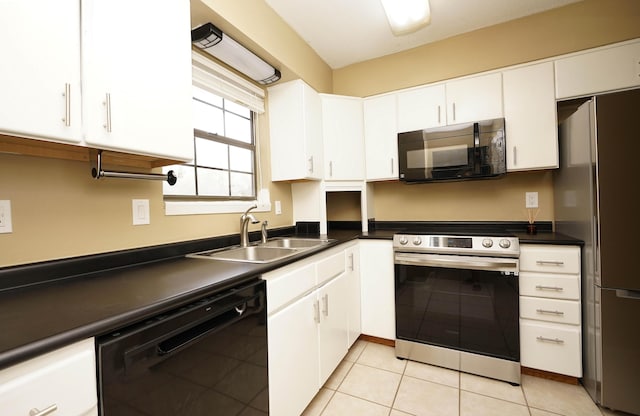 118 5th Ave Unit 118, Shalimar, FL 32579 - kitchen featuring stainless steel appliances, a sink, dark countertops, and white cabinetry