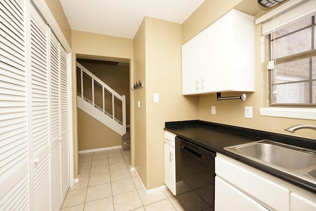 118 5th Ave Unit 118, Shalimar, FL 32579 - kitchen with dishwasher, dark countertops, a sink, white cabinets, and light tile patterned floors