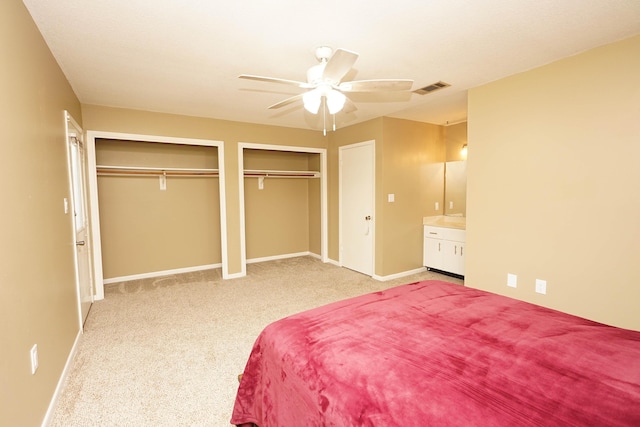 118 5th Ave Unit 118, Shalimar, FL 32579 - bedroom with multiple closets, carpet flooring, baseboards, and ceiling fan