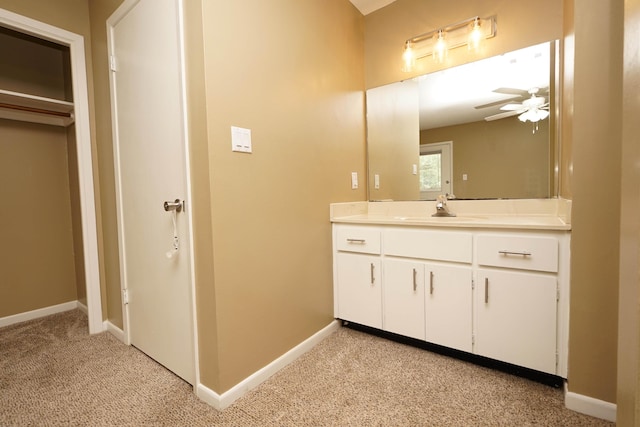 118 5th Ave Unit 118, Shalimar, FL 32579 - bathroom with ceiling fan, vanity, baseboards, and carpet