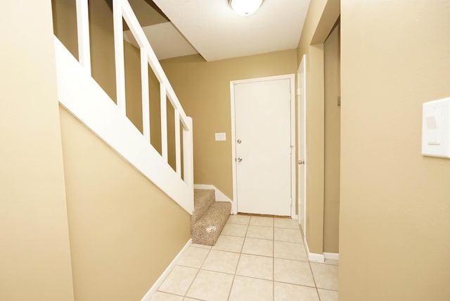 118 5th Ave Unit 118, Shalimar, FL 32579 - foyer featuring baseboards, light tile patterned floors, and stairs