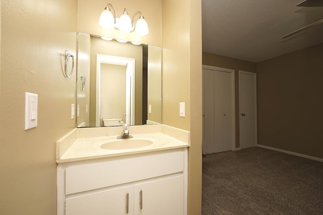 118 5th Ave Unit 118, Shalimar, FL 32579 - bathroom with vanity, baseboards, and toilet