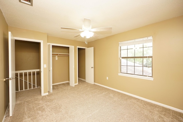 118 5th Ave Unit 118, Shalimar, FL 32579 - unfurnished bedroom with carpet floors, a closet, baseboards, and a ceiling fan