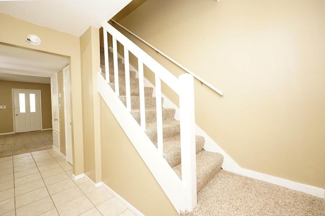 118 5th Ave Unit 118, Shalimar, FL 32579 - stairway with tile patterned flooring, baseboards, and carpet flooring