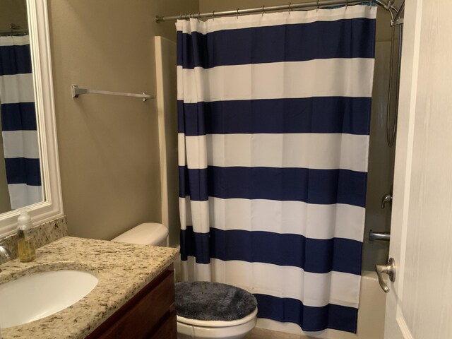 bathroom with toilet and vanity