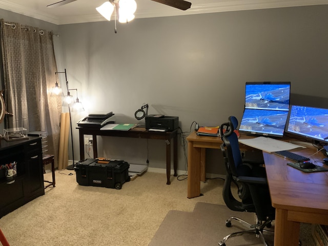 carpeted office space featuring crown molding and ceiling fan