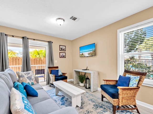 11 Beachside Dr Unit 1211, Santa Rosa Beach, FL 32459 - living area with plenty of natural light, baseboards, and wood finished floors