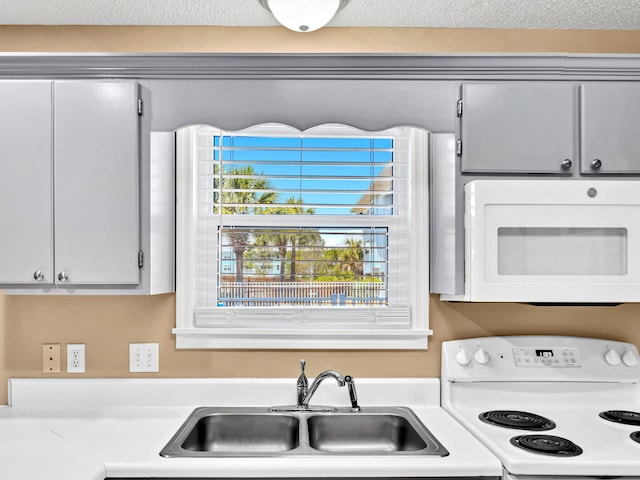 11 Beachside Dr Unit 1211, Santa Rosa Beach, FL 32459 - kitchen with white appliances, a sink, and light countertops