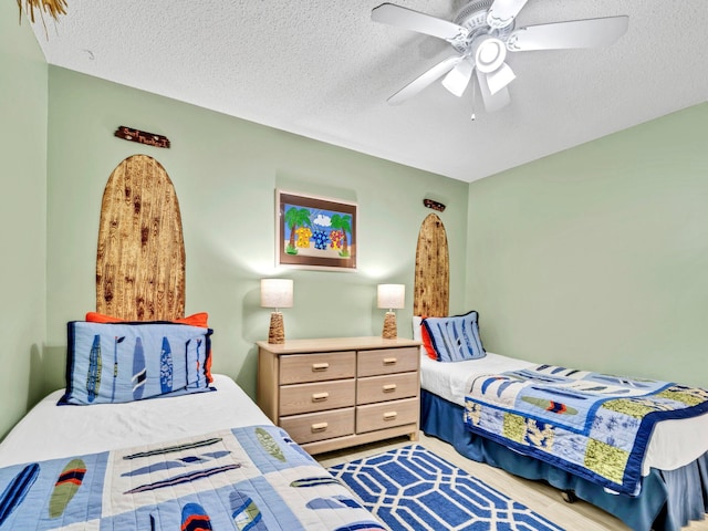 11 Beachside Dr Unit 1211, Santa Rosa Beach, FL 32459 - bedroom featuring a textured ceiling and ceiling fan