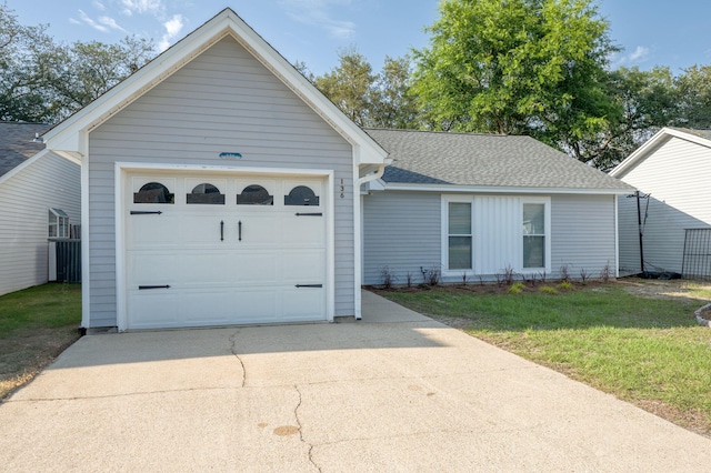 136 Midland Ct, Niceville, FL 32578 - ranch-style home featuring concrete driveway, roof with shingles, and a front yard