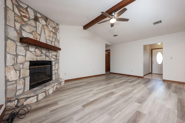 136 Midland Ct, Niceville, FL 32578 - unfurnished living room with a ceiling fan, a fireplace, wood finished floors, baseboards, and a textured ceiling