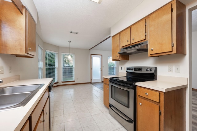 136 Midland Ct, Niceville, FL 32578 - kitchen featuring appliances with stainless steel finishes, under cabinet range hood, a sink, light countertops, and light tile patterned floors