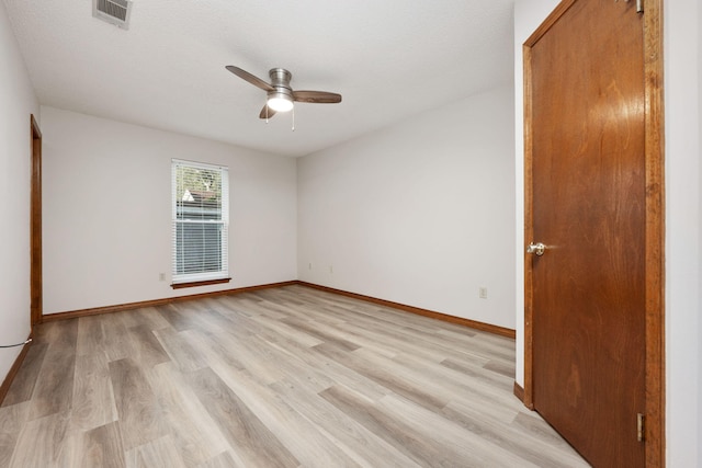 136 Midland Ct, Niceville, FL 32578 - empty room with a ceiling fan, light wood-type flooring, and baseboards