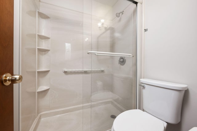 136 Midland Ct, Niceville, FL 32578 - bathroom featuring toilet and a stall shower