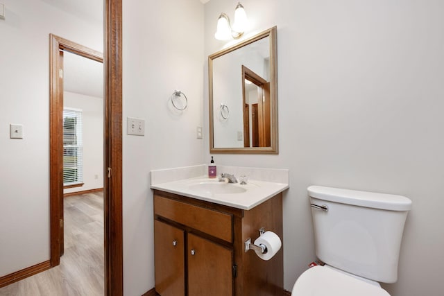 136 Midland Ct, Niceville, FL 32578 - half bath featuring toilet, vanity, and wood finished floors