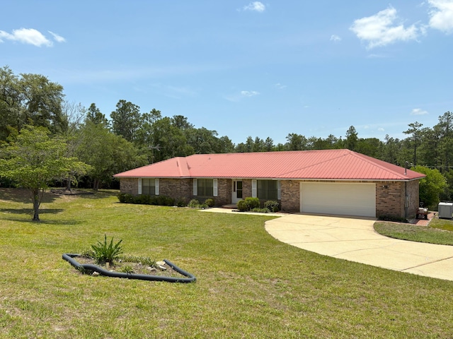 3864 Bear Head Rd, Crestview, FL 32539 - single story home with a garage, brick siding, concrete driveway, and a front yard