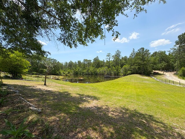 3864 Bear Head Rd, Crestview, FL 32539 - view of green lawn featuring a water view