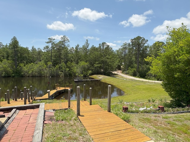 3864 Bear Head Rd, Crestview, FL 32539 - dock featuring a water view, a lawn, and a forest view