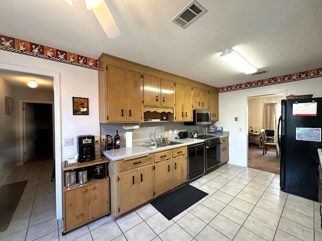3864 Bear Head Rd, Crestview, FL 32539 - kitchen with black appliances, a sink, light tile patterned floors, light countertops, and a textured ceiling