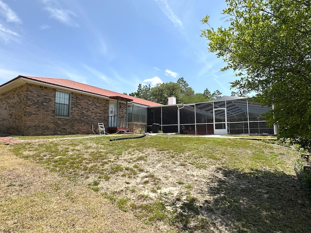 3864 Bear Head Rd, Crestview, FL 32539 - view of green lawn featuring a lanai