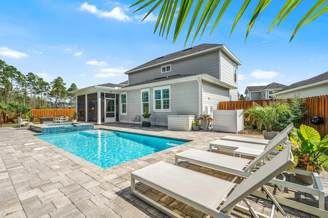 229 Windrow Way, Inlet Beach, FL 32461 - view of pool with a sunroom, a patio area, a fenced backyard, and a pool with connected hot tub