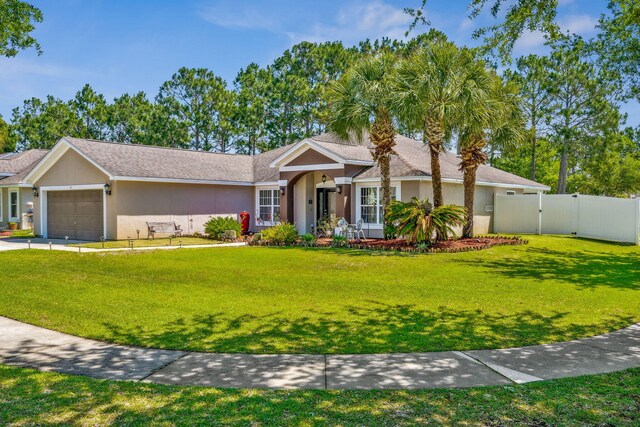 100 Kensington Cir, Panama City Beach, FL 32413 - ranch-style home with stucco siding, a gate, and a garage