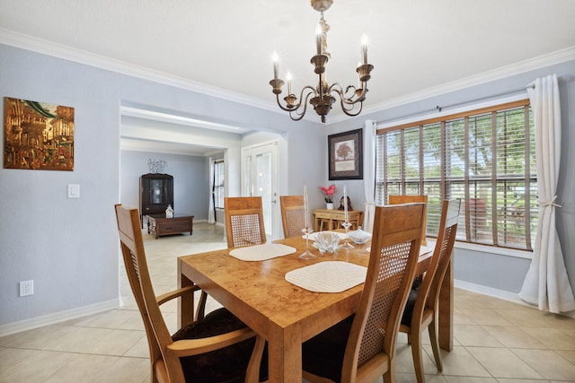 100 Kensington Cir, Panama City Beach, FL 32413 - dining area featuring light tile patterned floors, crown molding, baseboards, and a chandelier
