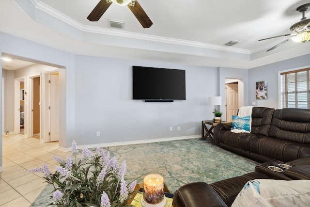 100 Kensington Cir, Panama City Beach, FL 32413 - living room with ceiling fan, light tile patterned flooring, baseboards, ornamental molding, and a raised ceiling